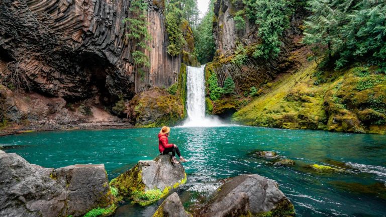 A man relaxes on a rock